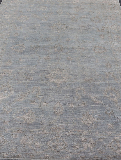 Modern Hand - Knotted Rug in Wool with Floral Design in Blue and Gray This modern Indian rug has been hand - knotted in wool and features an all - over, sub - geometric floral design rendered in blue and gray tones. A complementary, multi - tiered border ... - Keivan Woven ArtsOB - 105860644 - 17346