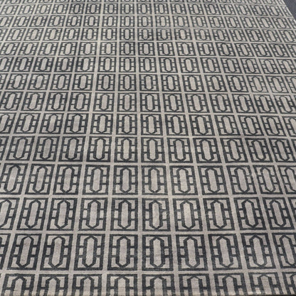 Modern Hand - Knotted Rug in Wool with All - Over Geometric Design in Gray and Black This modern India rug has been hand - knotted in wool and features an all - over geometric design rendered in gray and black tones. A complementary, multi - tiered borde... - Keivan Woven ArtsOB - 106011594 - 12560129 - 15518Rug
