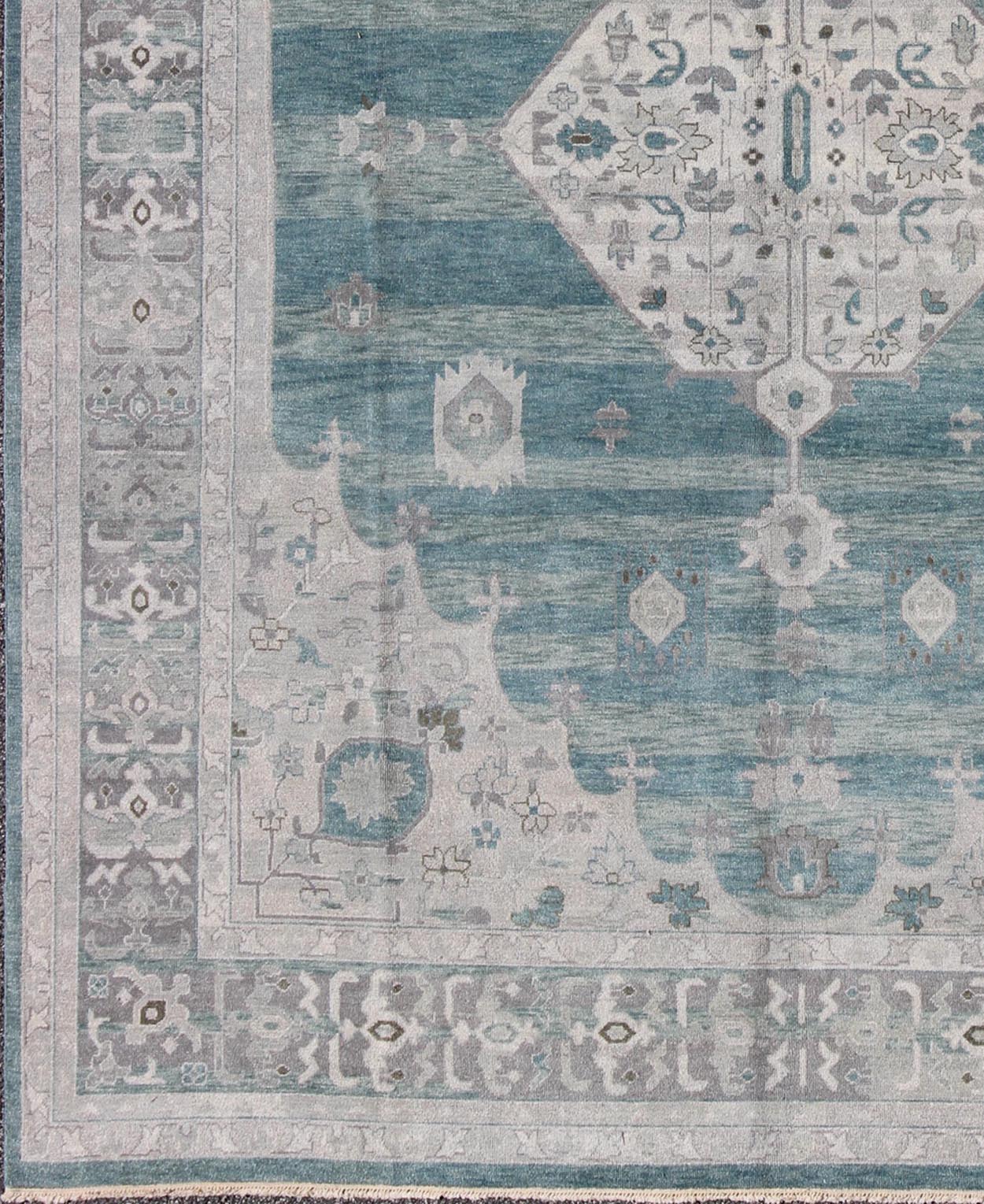 Modern Hand - Knotted Oushak Rug With Central Medallion Design in Gray and Green Tones This modern Indian Oushak rug has been hand - knotted in wool and features a central sub - geometric medallion design rendered in gray/silver and seafoam tones. A c... - Keivan Woven ArtsOB - 9261028 - 0131046 - 4018Rug