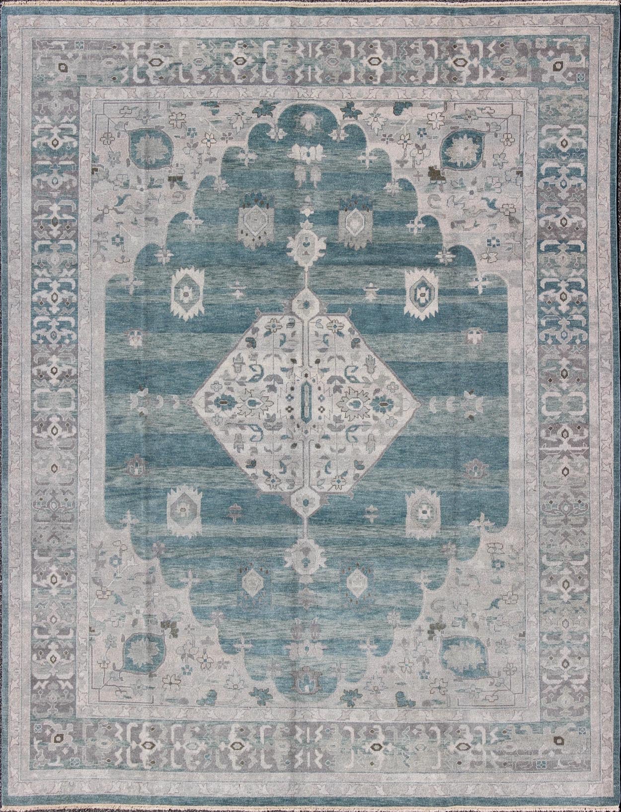 Modern Hand - Knotted Oushak Rug With Central Medallion Design in Gray and Green Tones This modern Indian Oushak rug has been hand - knotted in wool and features a central sub - geometric medallion design rendered in gray/silver and seafoam tones. A c... - Keivan Woven ArtsOB - 9261028 - 0131046 - 4018Rug