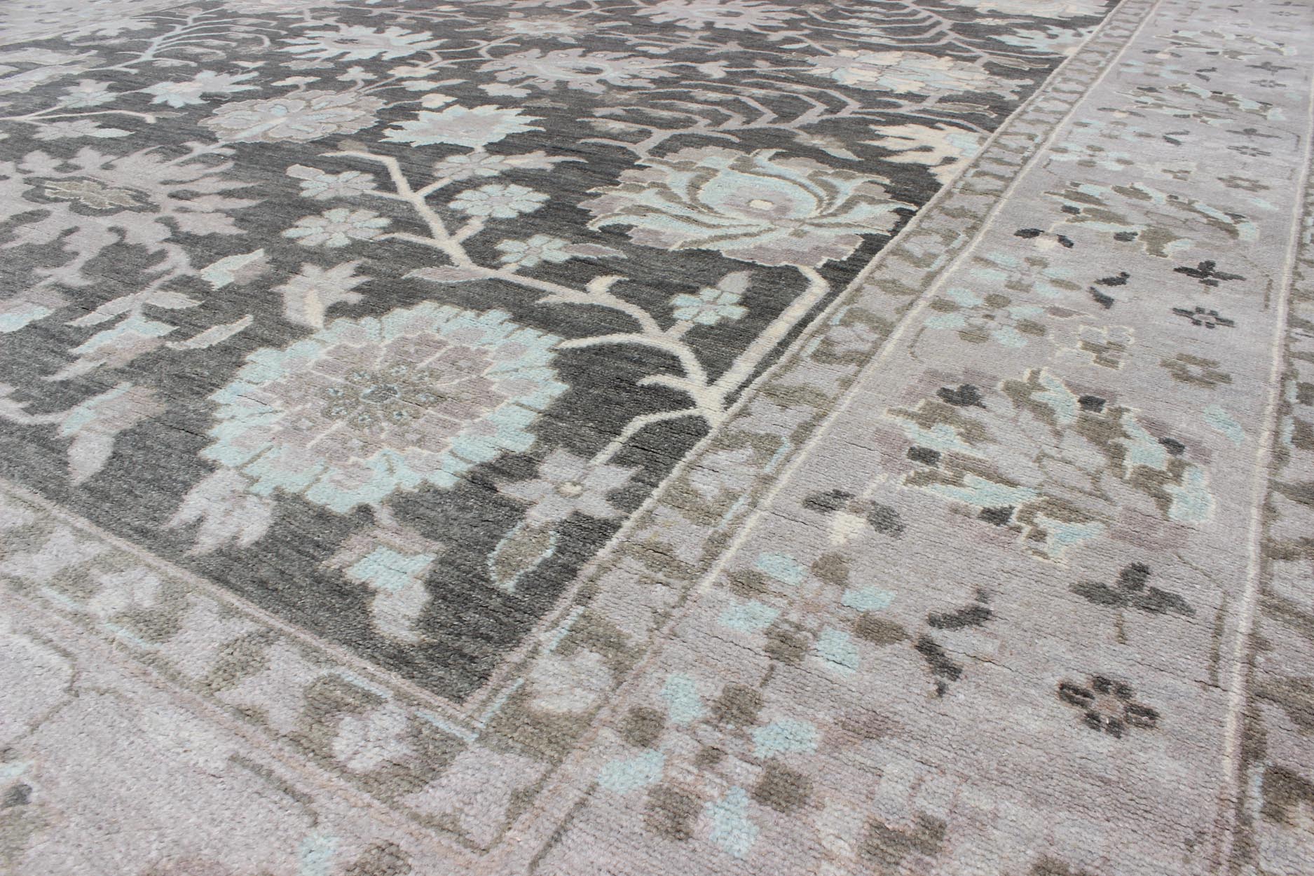 Modern Oushak with Floral Design in Gray, Taupe, Lt. Blue, Lt. Brown & Cream This beautiful floral Oushak in anchored by Gray background and taupe border, Keivan Woven Arts rug OB - 9288503 - 271010, country of origin / type: India / Oushak, circa... - Keivan Woven ArtsOB - 9288503 - 271010 - 8515Rug
