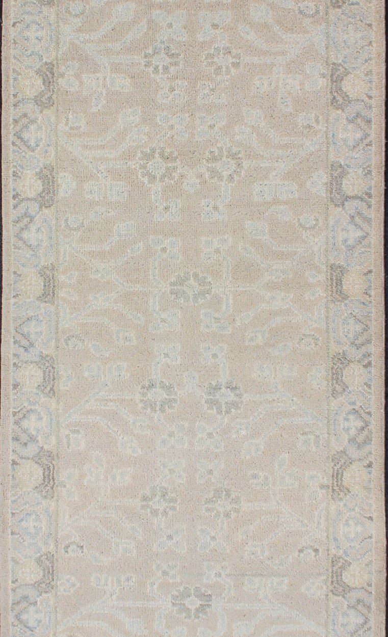 Modern Khotan Runner in Wool with All - Over Sub - Geometric Floral Design This modern Indian Khotan rug has been hand - knotted in wool and features an all - over, sub - geometric floral design rendered in blue and neutral tones. A complementary border e... - Keivan Woven ArtsOB - 9289470 - 6270004 - 11332Rug