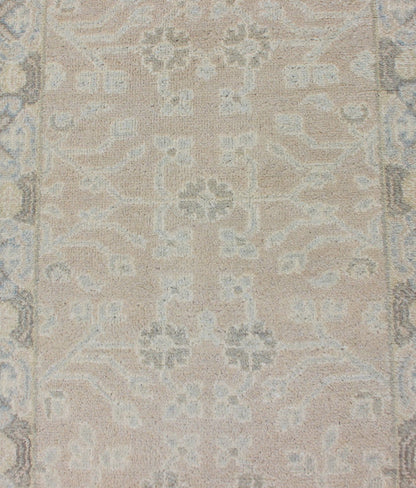Modern Khotan Runner in Wool with All - Over Sub - Geometric Floral Design This modern Indian Khotan rug has been hand - knotted in wool and features an all - over, sub - geometric floral design rendered in blue and neutral tones. A complementary border e... - Keivan Woven ArtsOB - 9289470 - 6270004 - 11332Rug