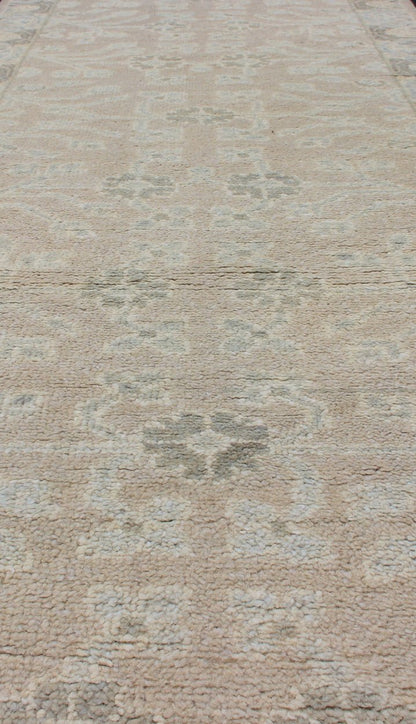 Modern Khotan Runner in Wool with All - Over Sub - Geometric Floral Design This modern Indian Khotan rug has been hand - knotted in wool and features an all - over, sub - geometric floral design rendered in blue and neutral tones. A complementary border e... - Keivan Woven ArtsOB - 9289470 - 6270004 - 11332Rug
