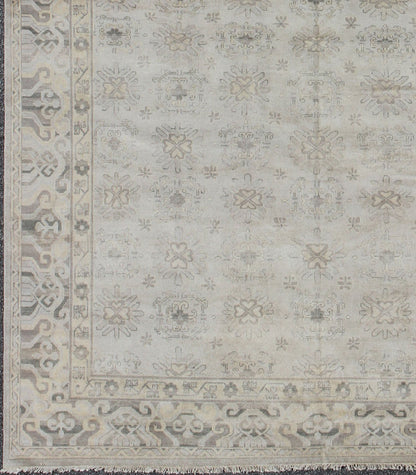 Keivan Woven Arts Hand Knotted Khotan Wool Rug With Sub - Geometric Design. This contemporary Khotan rug has been hand - knotted in wool and features a sub - geometric design rendered in tan and taupe colors. A complementary, multi - tiered border enc... - Keivan Woven ArtsOB - 9299796 - 592009 - 8519Rug