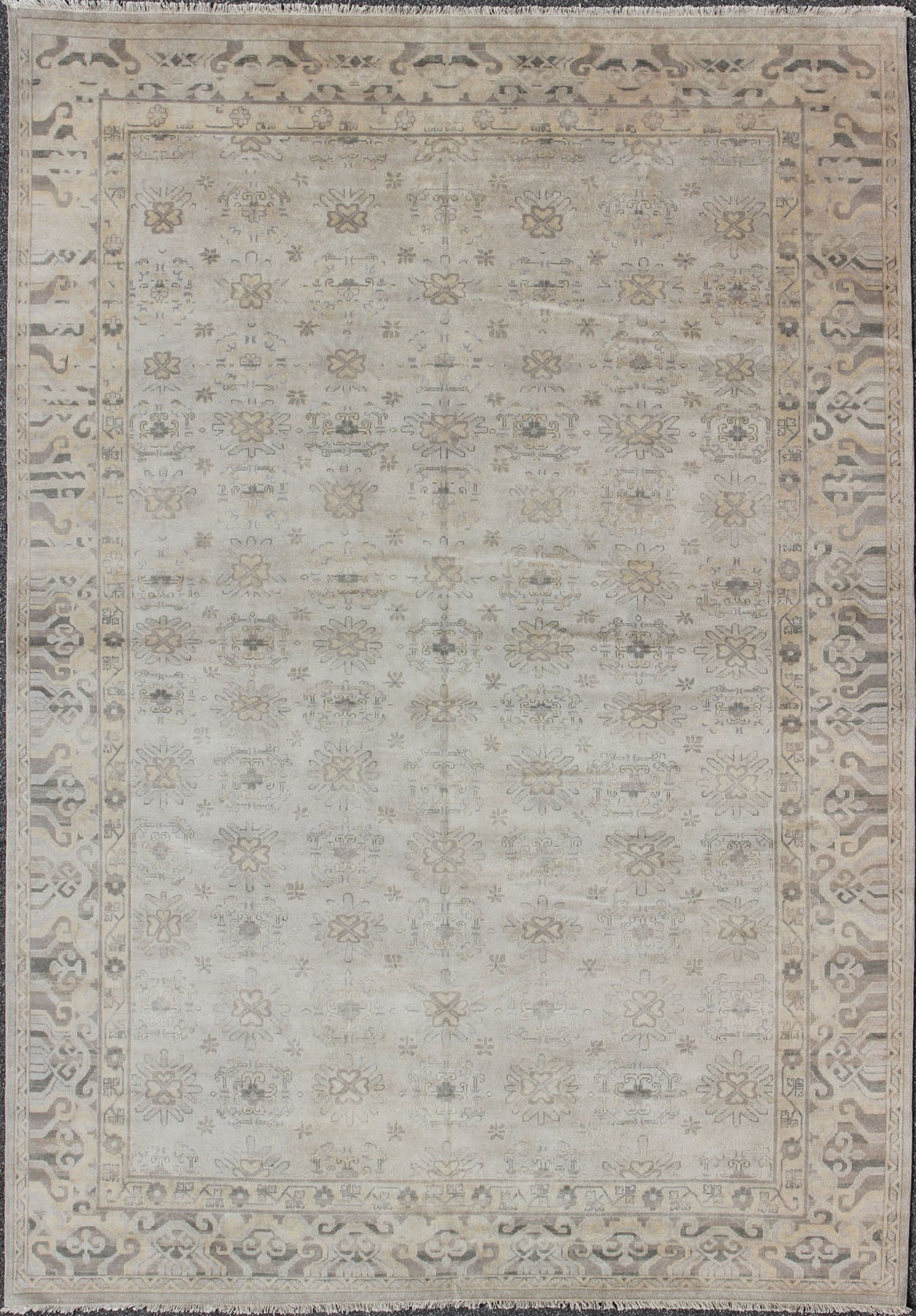 Keivan Woven Arts Hand Knotted Khotan Wool Rug With Sub - Geometric Design. This contemporary Khotan rug has been hand - knotted in wool and features a sub - geometric design rendered in tan and taupe colors. A complementary, multi - tiered border enc... - Keivan Woven ArtsOB - 9299796 - 592009 - 8519Rug