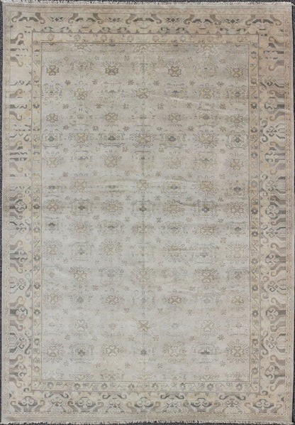 Keivan Woven Arts Hand Knotted Khotan Wool Rug With Sub - Geometric Design. This contemporary Khotan rug has been hand - knotted in wool and features a sub - geometric design rendered in tan and taupe colors. A complementary, multi - tiered border enc... - Keivan Woven ArtsOB - 9299796 - 592009 - 8519Rug