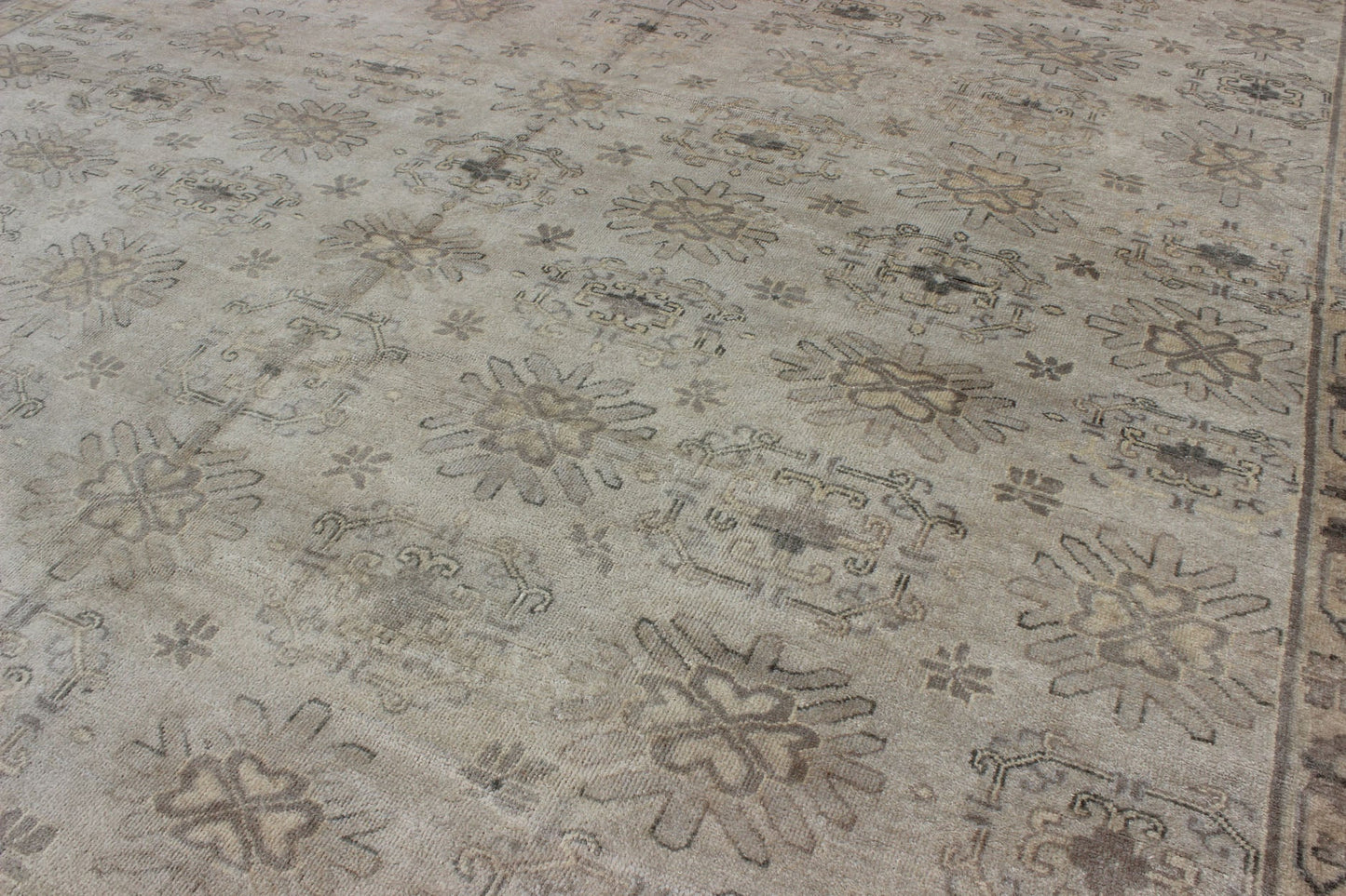 Keivan Woven Arts Hand Knotted Khotan Wool Rug With Sub - Geometric Design. This contemporary Khotan rug has been hand - knotted in wool and features a sub - geometric design rendered in tan and taupe colors. A complementary, multi - tiered border enc... - Keivan Woven ArtsOB - 9299796 - 592009 - 8519Rug