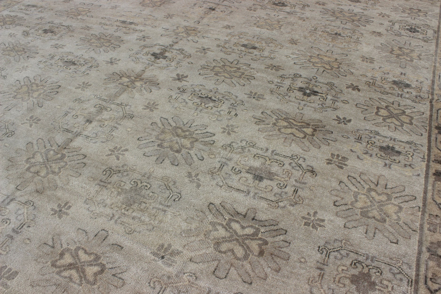 Keivan Woven Arts Hand Knotted Khotan Wool Rug With Sub - Geometric Design. This contemporary Khotan rug has been hand - knotted in wool and features a sub - geometric design rendered in tan and taupe colors. A complementary, multi - tiered border enc... - Keivan Woven ArtsOB - 9299796 - 592009 - 8519Rug