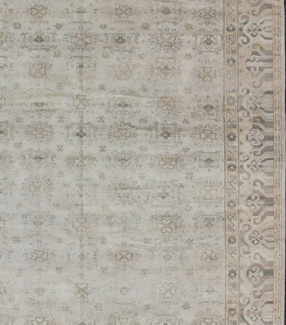 Keivan Woven Arts Hand Knotted Khotan Wool Rug With Sub - Geometric Design. This contemporary Khotan rug has been hand - knotted in wool and features a sub - geometric design rendered in tan and taupe colors. A complementary, multi - tiered border enc... - Keivan Woven ArtsOB - 9299796 - 592009 - 8519Rug