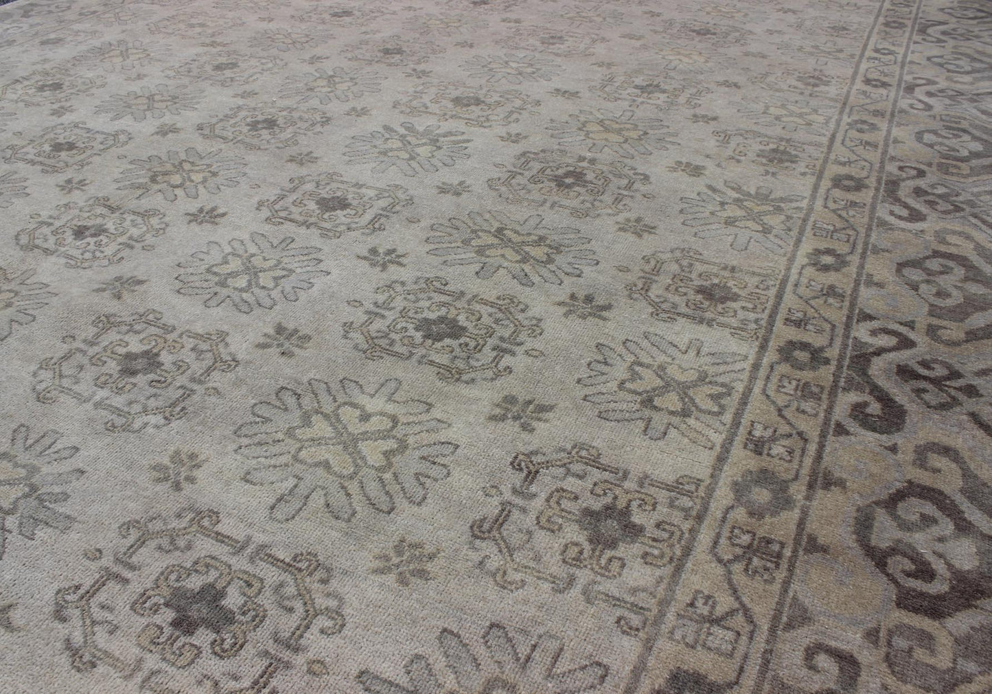 Keivan Woven Arts Hand Knotted Khotan Wool Rug With Sub - Geometric Design. This contemporary Khotan rug has been hand - knotted in wool and features a sub - geometric design rendered in tan and taupe colors. A complementary, multi - tiered border enc... - Keivan Woven ArtsOB - 9299796 - 592009 - 8519Rug