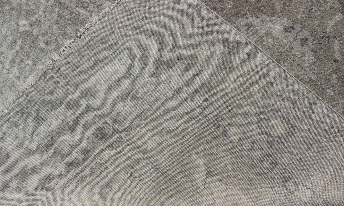 Modern Oushak Light Colored Rug in Taupe, Sand, Light Purple/Lavender and Grey. Measures: 9' x12'. This exquisite Vintage Oushak rug displays a fun mlange of floral and geometric designs, rendered in gray and lavender enclose within a bo... - Keivan Woven ArtsOB - 9413053 - 8169Rug