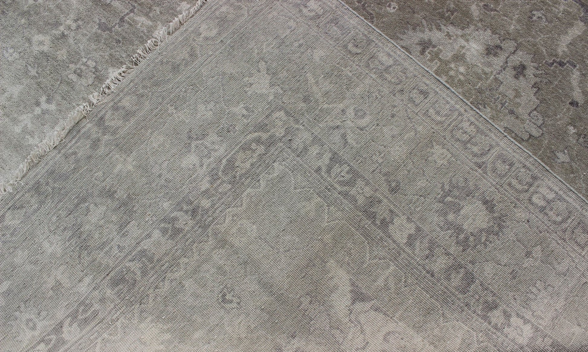 Modern Oushak Light Colored Rug in Taupe, Sand, Light Purple/Lavender and Grey. Measures: 9' x12'. This exquisite Vintage Oushak rug displays a fun mlange of floral and geometric designs, rendered in gray and lavender enclose within a bo... - Keivan Woven ArtsOB - 9413053 - 8169Rug