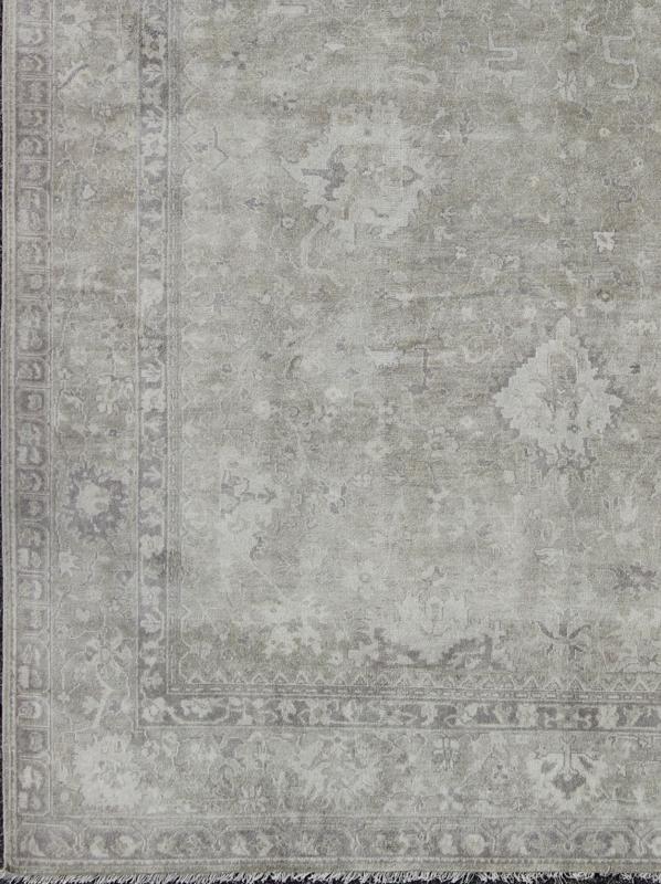 Modern Oushak Light Colored Rug in Taupe, Sand, Light Purple/Lavender and Grey. Measures: 9' x12'. This exquisite Vintage Oushak rug displays a fun mlange of floral and geometric designs, rendered in gray and lavender enclose within a bo... - Keivan Woven ArtsOB - 9413053 - 8169Rug