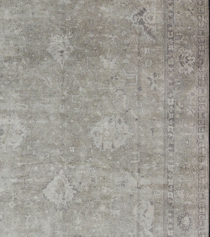 Modern Oushak Light Colored Rug in Taupe, Sand, Light Purple/Lavender and Grey. Measures: 9' x12'. This exquisite Vintage Oushak rug displays a fun mlange of floral and geometric designs, rendered in gray and lavender enclose within a bo... - Keivan Woven ArtsOB - 9413053 - 8169Rug