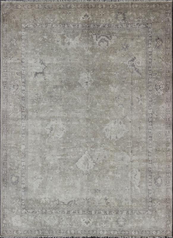 Modern Oushak Light Colored Rug in Taupe, Sand, Light Purple/Lavender and Grey. Measures: 9' x12'. This exquisite Vintage Oushak rug displays a fun mlange of floral and geometric designs, rendered in gray and lavender enclose within a bo... - Keivan Woven ArtsOB - 9413053 - 8169Rug