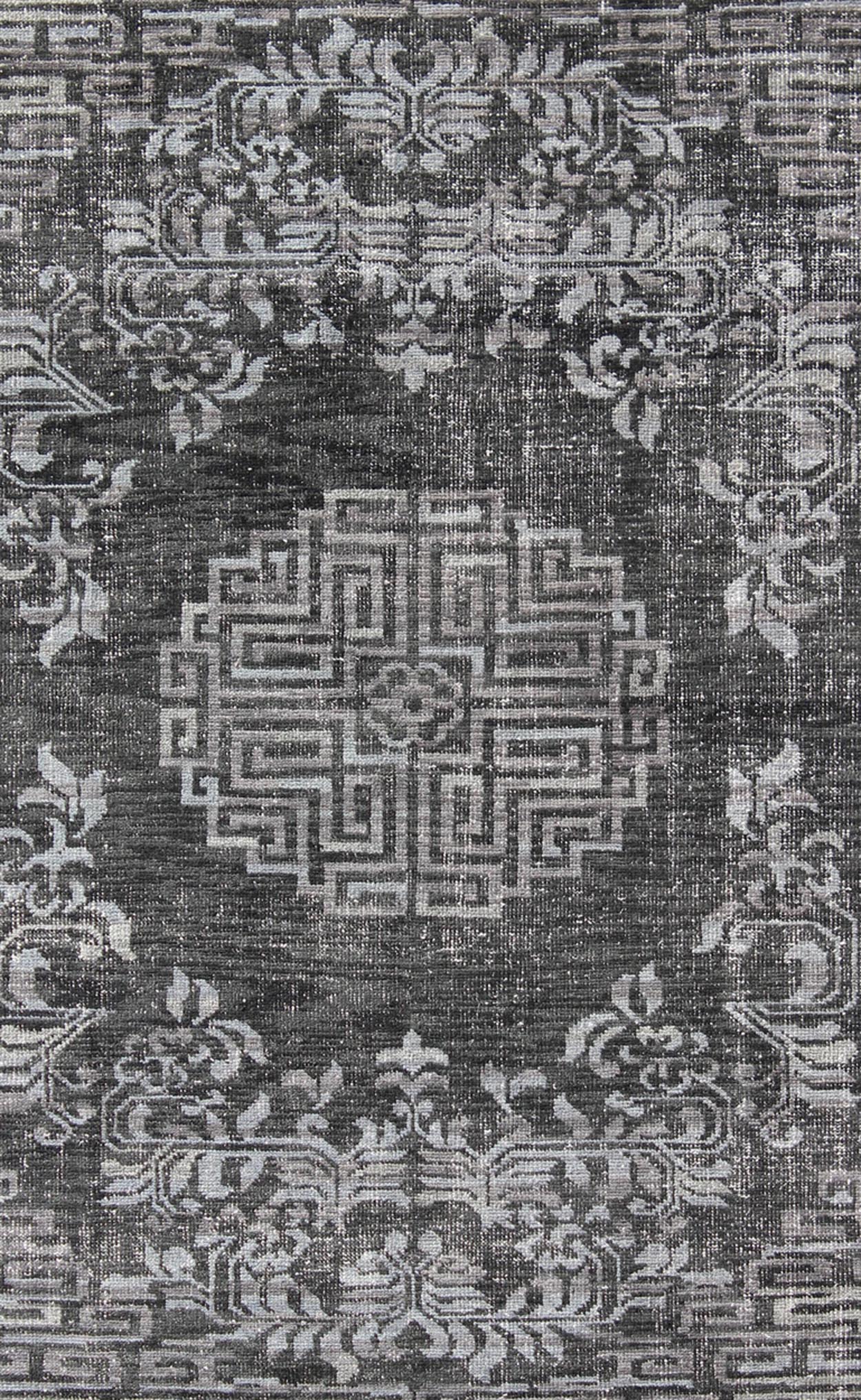 Keivan Woven Arts Modern Khotan Hand Knotted Wool Rug in Charcoal & Gray. This modern Khotan rug has been hand - knotted features an all - over, sub - geometric late central medallion design rendered in charcoal and gray tones. A complementary border encompa... - Keivan Woven ArtsOB - 9444206 - 56230109 - 9308Rug