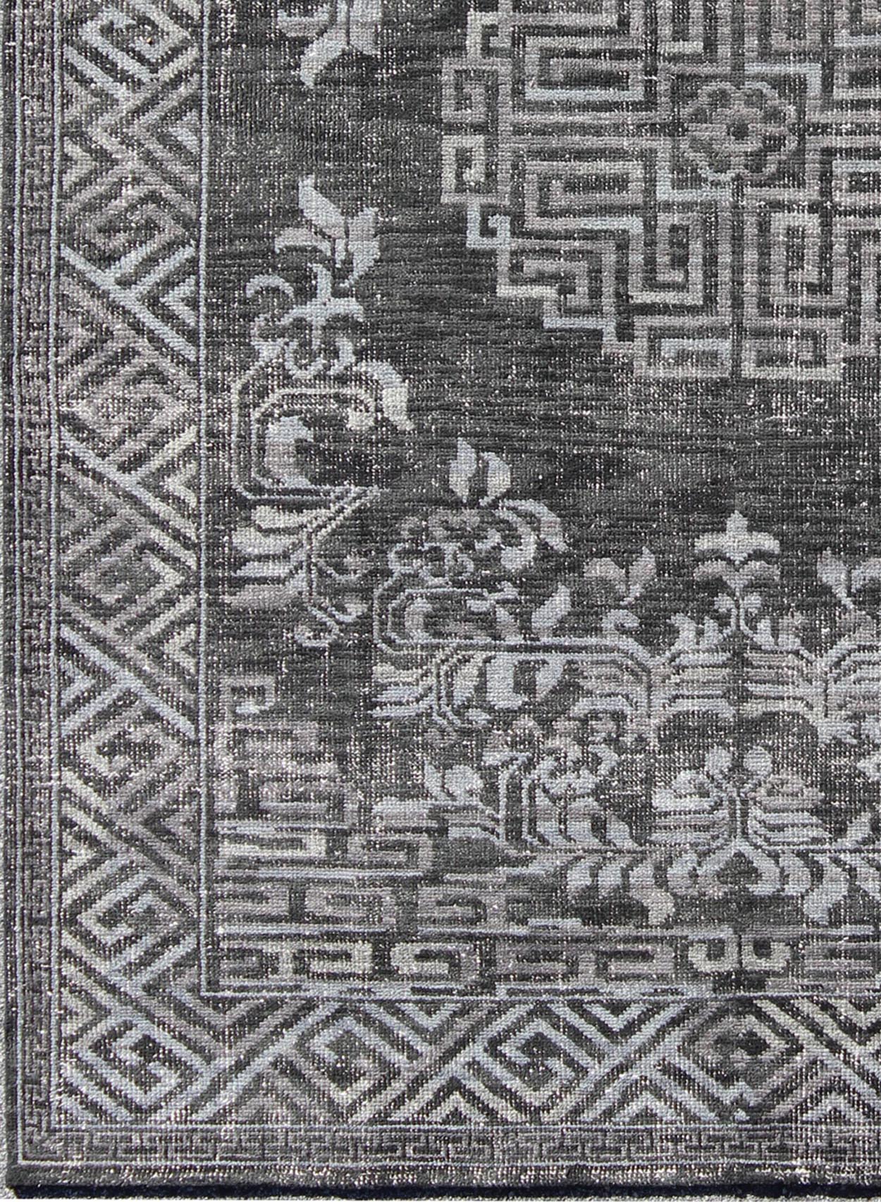 Keivan Woven Arts Modern Khotan Hand Knotted Wool Rug in Charcoal & Gray. This modern Khotan rug has been hand - knotted features an all - over, sub - geometric late central medallion design rendered in charcoal and gray tones. A complementary border encompa... - Keivan Woven ArtsOB - 9444206 - 56230109 - 9308Rug