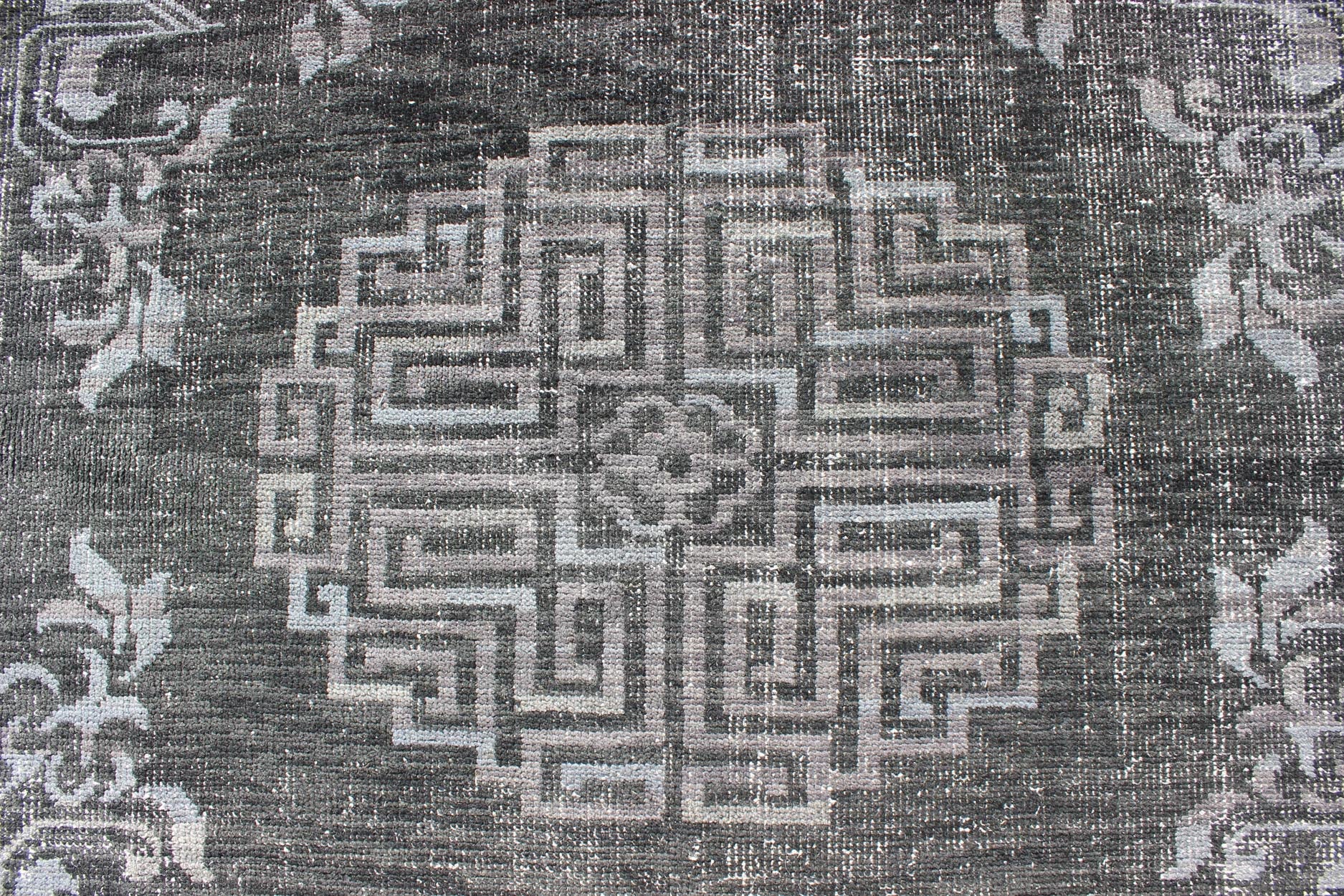 Keivan Woven Arts Modern Khotan Hand Knotted Wool Rug in Charcoal & Gray. This modern Khotan rug has been hand - knotted features an all - over, sub - geometric late central medallion design rendered in charcoal and gray tones. A complementary border encompa... - Keivan Woven ArtsOB - 9444206 - 56230109 - 9308Rug