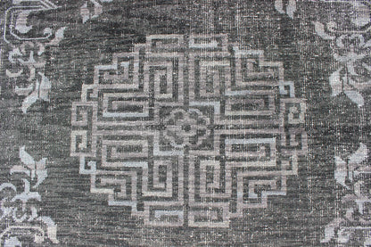 Keivan Woven Arts Modern Khotan Hand Knotted Wool Rug in Charcoal & Gray. This modern Khotan rug has been hand - knotted features an all - over, sub - geometric late central medallion design rendered in charcoal and gray tones. A complementary border encompa... - Keivan Woven ArtsOB - 9444206 - 56230109 - 9308Rug