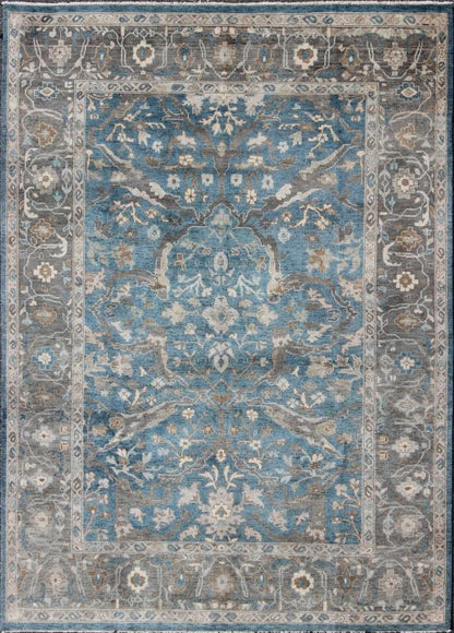Blue and Gray Vintage Oushak Rug. Measures: 9' x 12'. This vintage Oushak carpet from Turkey features a all over traditional Oushak design rendered in tones of blue and gray, set atop a blue background. The central field features floating motifs ... - Keivan Woven ArtsOB - 9458373 - 06470003 - 8175Rug