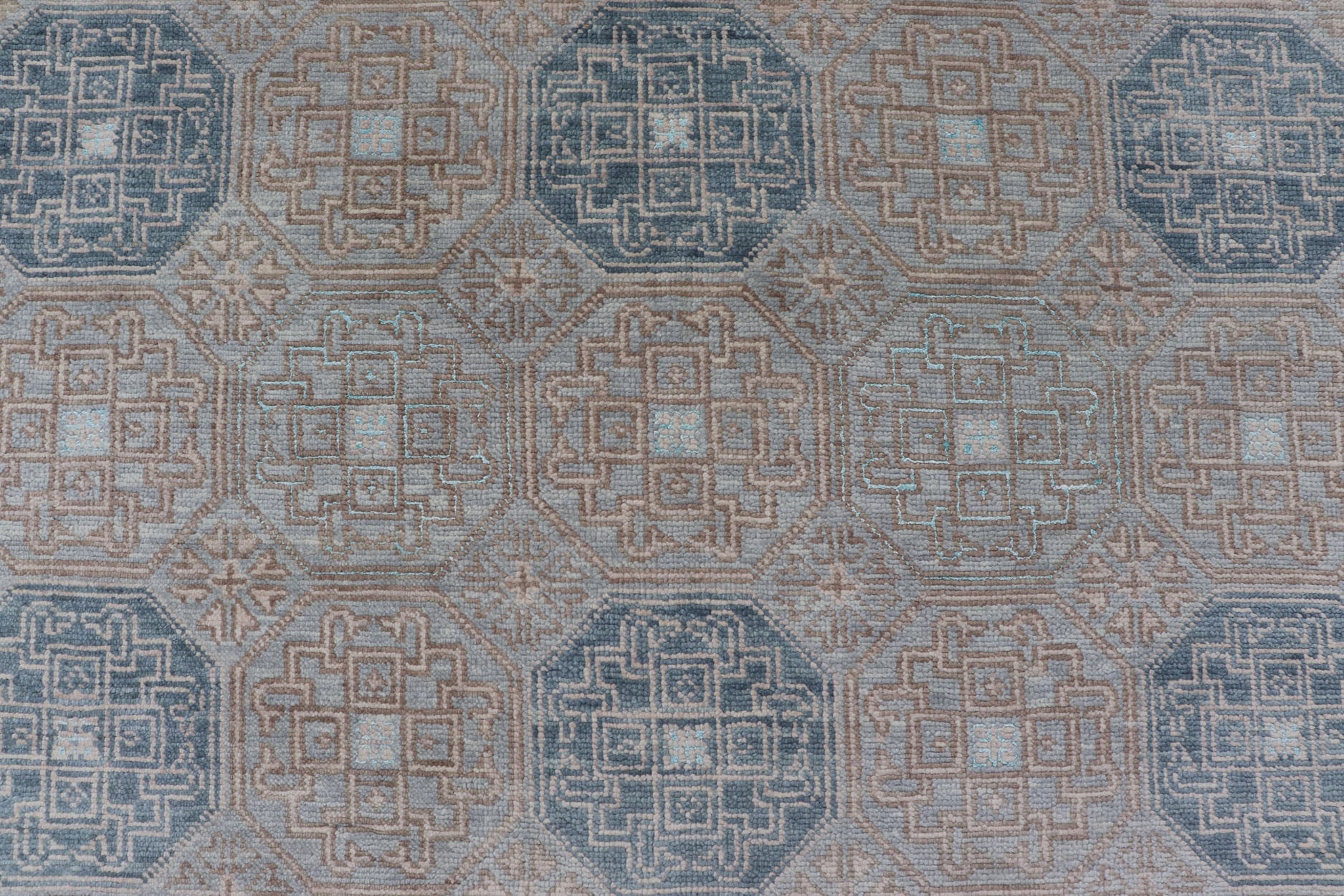 Modern Hand Knotted Khotan in Wool with All - Over Medallion Design in Blue and Earthy Tones This modern Indian Khotan rug has been hand - knotted in wool and features an all - over, sub - geometric medallion design rendered in blue and earthy tones. A ... - Keivan Woven ArtsOB - 9538562 - 98000069 - 15490Rug