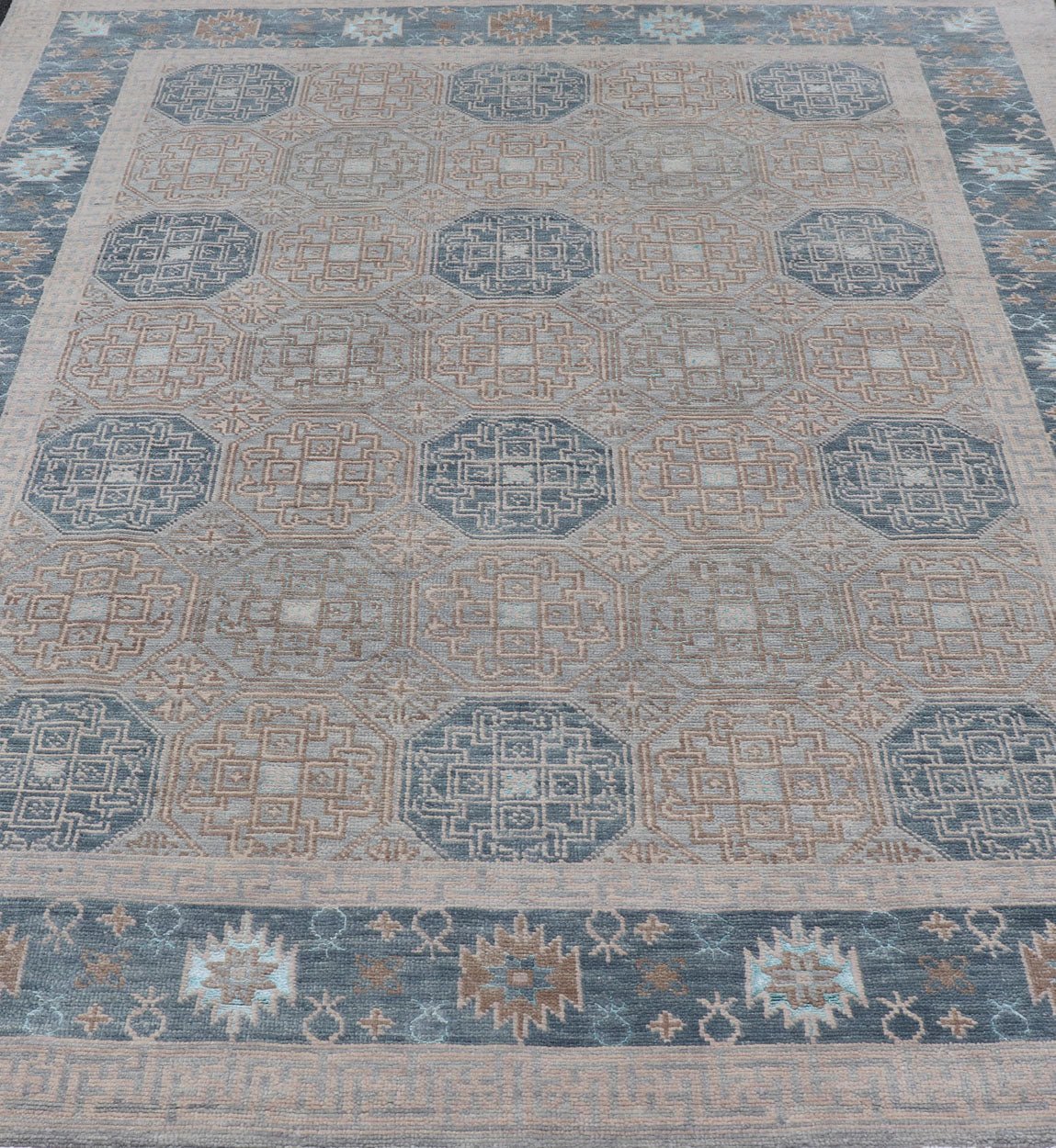 Modern Hand Knotted Khotan in Wool with All - Over Medallion Design in Blue and Earthy Tones This modern Indian Khotan rug has been hand - knotted in wool and features an all - over, sub - geometric medallion design rendered in blue and earthy tones. A ... - Keivan Woven ArtsOB - 9538562 - 98000069 - 15490Rug