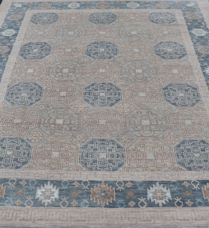 Modern Hand Knotted Khotan in Wool with All - Over Medallion Design in Blue and Earthy Tones This modern Indian Khotan rug has been hand - knotted in wool and features an all - over, sub - geometric medallion design rendered in blue and earthy tones. A ... - Keivan Woven ArtsOB - 9538562 - 98000069 - 15490Rug