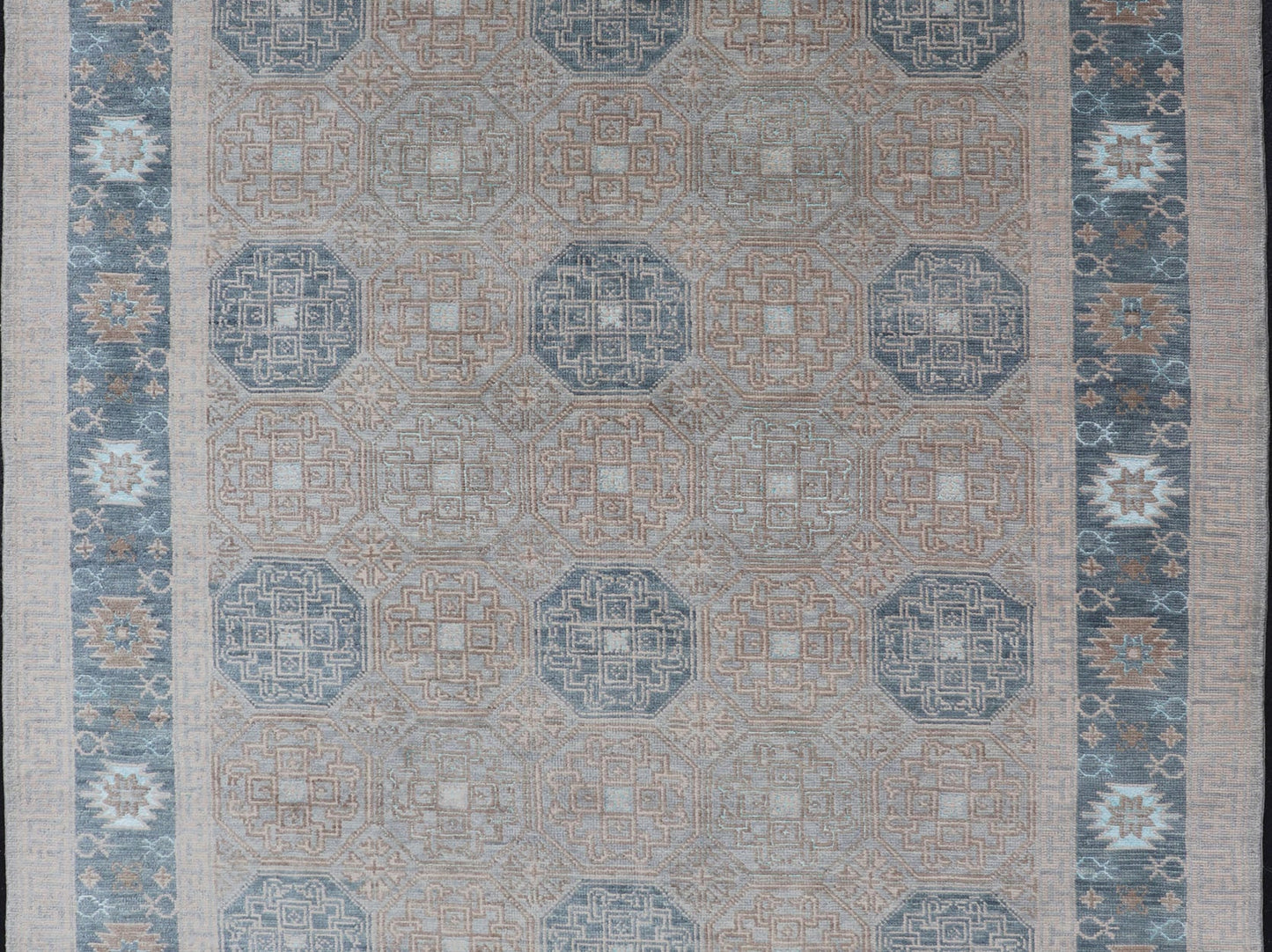 Modern Hand Knotted Khotan in Wool with All - Over Medallion Design in Blue and Earthy Tones This modern Indian Khotan rug has been hand - knotted in wool and features an all - over, sub - geometric medallion design rendered in blue and earthy tones. A ... - Keivan Woven ArtsOB - 9538562 - 98000069 - 15490Rug