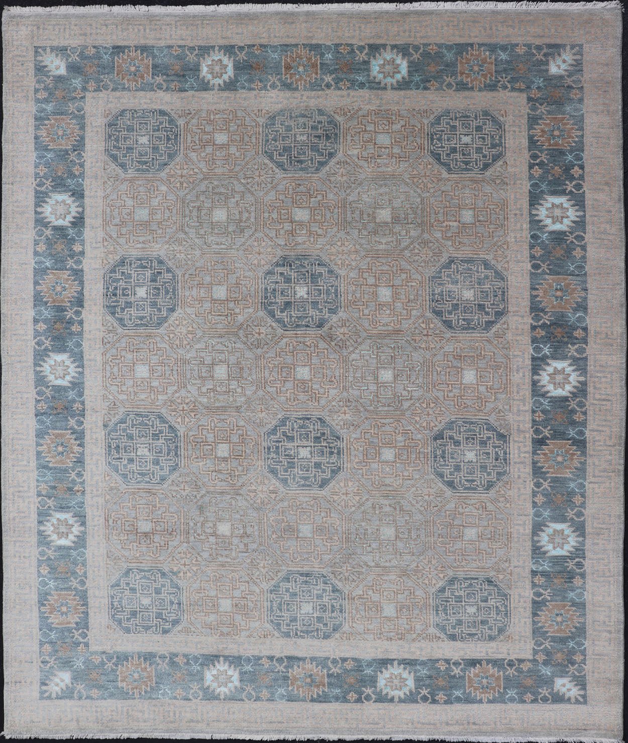 Modern Hand Knotted Khotan in Wool with All - Over Medallion Design in Blue and Earthy Tones This modern Indian Khotan rug has been hand - knotted in wool and features an all - over, sub - geometric medallion design rendered in blue and earthy tones. A ... - Keivan Woven ArtsOB - 9538562 - 98000069 - 15490Rug