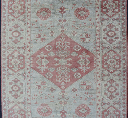 Modern Oushak Rug in Wool with Medallion Design in Light Blue and Coral This modern Indian Khotan rug has been hand - knotted in wool and features a floral medallion design rendered in light blue and coral tones. A complementary, multi - tiered bor... - Keivan Woven ArtsOB - 9580377 - 83230118 - 15502Rug