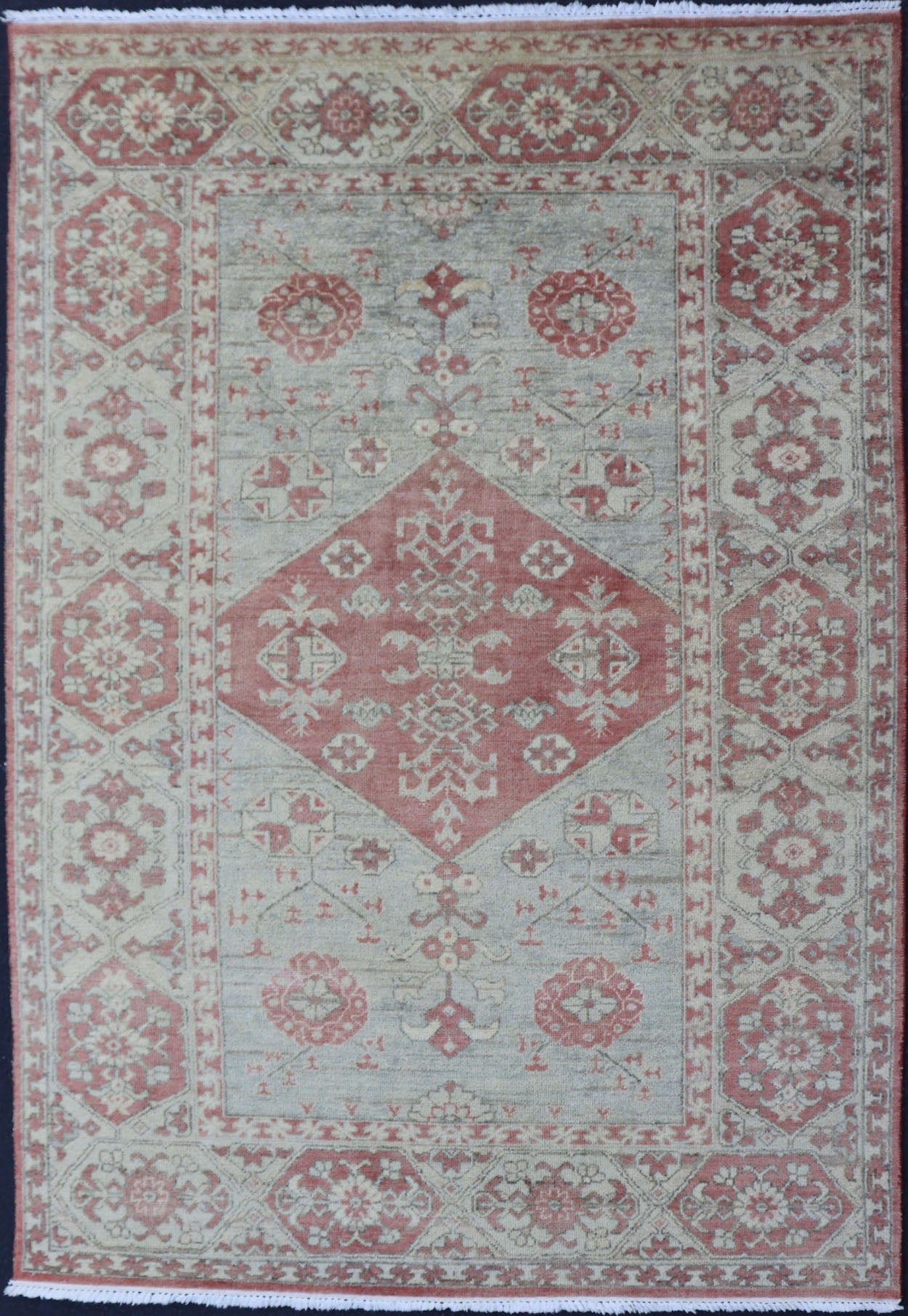 Modern Oushak Rug in Wool with Medallion Design in Light Blue and Coral This modern Indian Khotan rug has been hand - knotted in wool and features a floral medallion design rendered in light blue and coral tones. A complementary, multi - tiered bor... - Keivan Woven ArtsOB - 9580377 - 83230118 - 15502