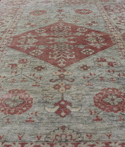 Modern Oushak Rug in Wool with Medallion Design in Light Blue and Coral This modern Indian Khotan rug has been hand - knotted in wool and features a floral medallion design rendered in light blue and coral tones. A complementary, multi - tiered bor... - Keivan Woven ArtsOB - 9580377 - 83230118 - 15502Rug