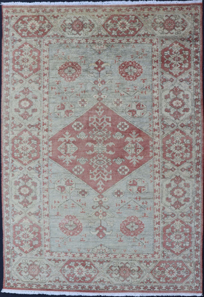 Modern Oushak Rug in Wool with Medallion Design in Light Blue and Coral This modern Indian Khotan rug has been hand - knotted in wool and features a floral medallion design rendered in light blue and coral tones. A complementary, multi - tiered bor... - Keivan Woven ArtsOB - 9580377 - 83230118 - 15502Rug