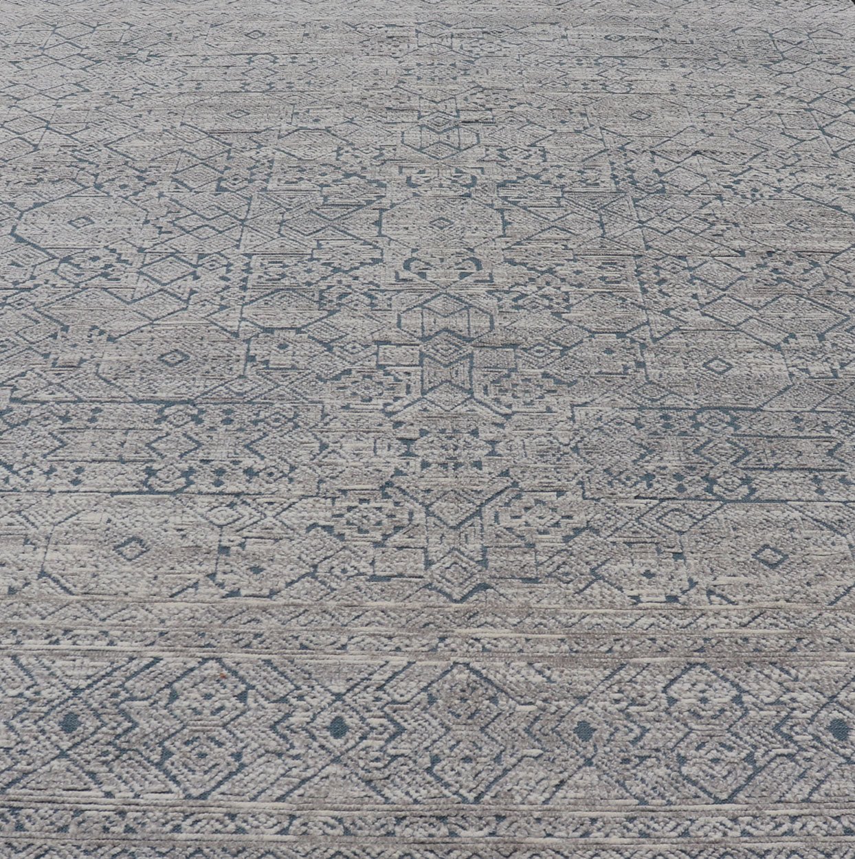 Hand - Knotted Modern Rug in Wool with All - Over Design in Blue and Cream This Modern Indian rug has been hand - knotted in wool and features an all - over, sub - geometric design rendered in blue and cream tones. A complementary, multi - tiered border en... - Keivan Woven ArtsOB - 9599733 - 18174Rug
