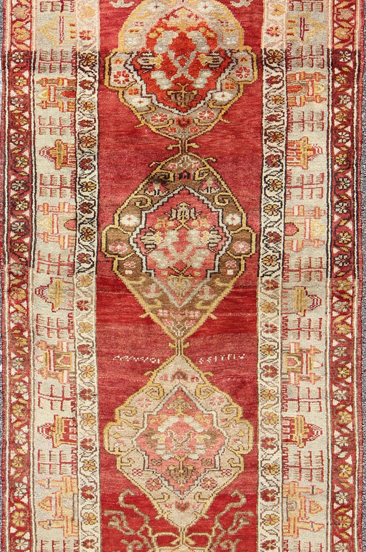 Antique Turkish Oushak Runner In Red Background with Neutral Medallions Measures: 3.11 x 9.0 This colorful Oushak carpet rests beautifully upon a field of elegant red. A large medallion of brown, taupe, yellow and gray takes center s... - Keivan Woven ArtsOSM - 02 - 4494Rug