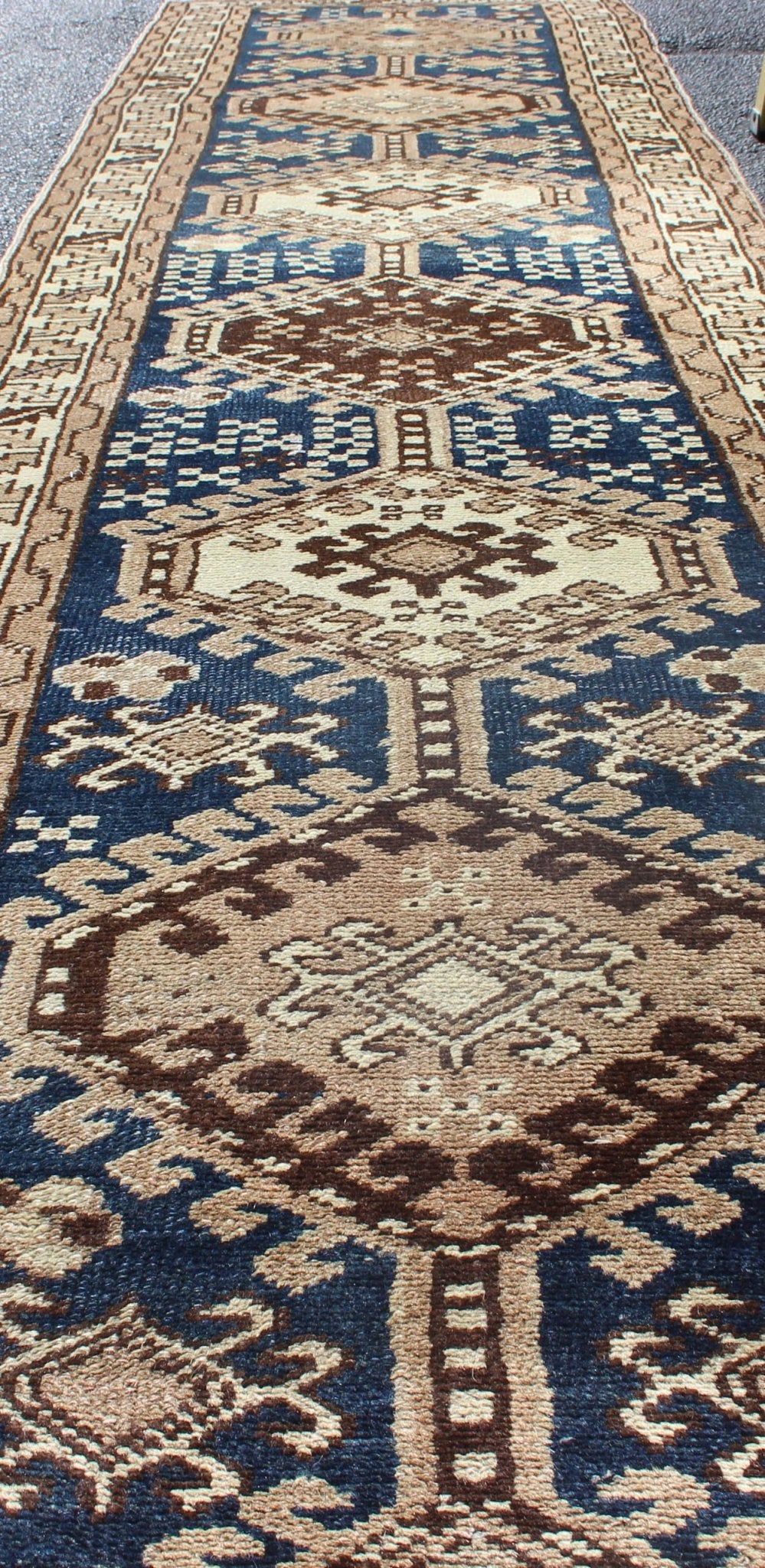 Antique Blue Tribal Karajeh Runner With Navy Blue, Brown and Earth Tones. Antique Persian Karajeh runner with stacked medallion in taupe, cream, blue, rug PRM - M522, country of origin / type: Iran / Karajeh , circa 1920 This antique Persian k... - Keivan Woven ArtsPRM - M522 - 12609