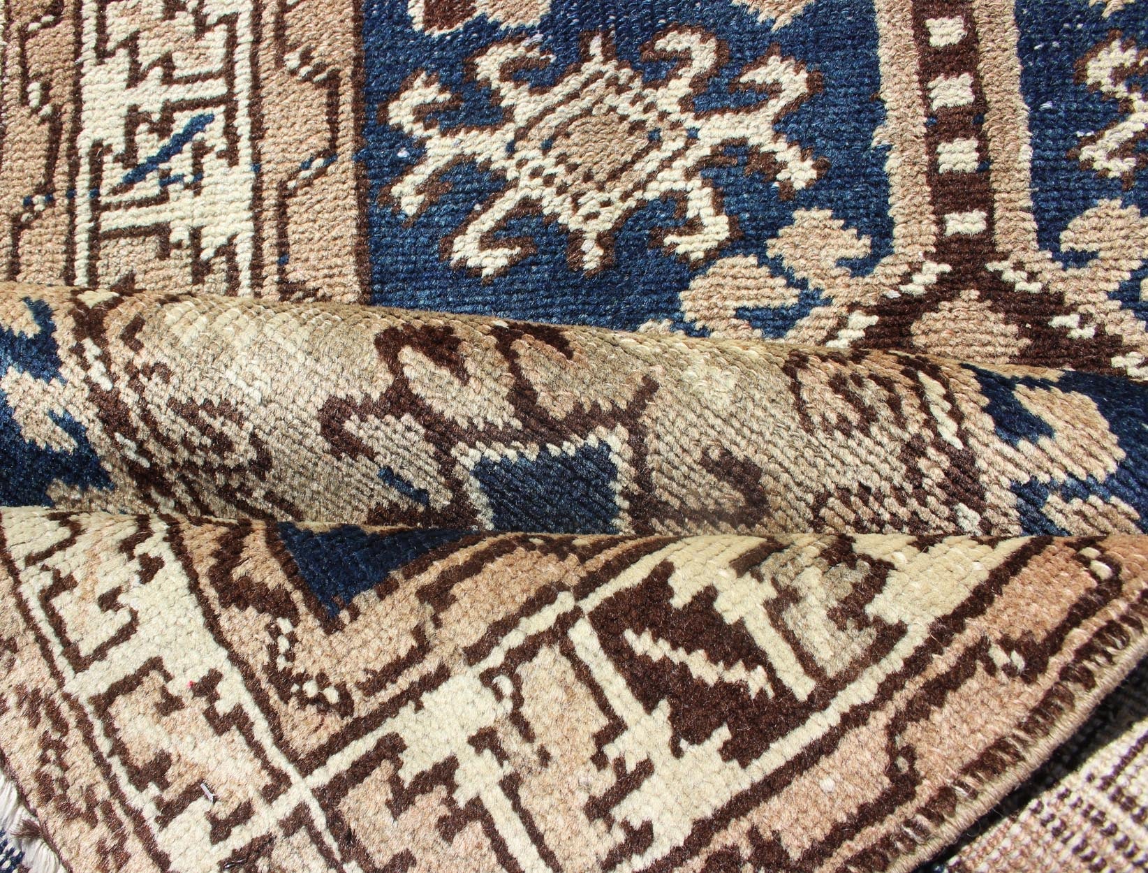 Antique Blue Tribal Karajeh Runner With Navy Blue, Brown and Earth Tones. Antique Persian Karajeh runner with stacked medallion in taupe, cream, blue, rug PRM - M522, country of origin / type: Iran / Karajeh , circa 1920 This antique Persian k... - Keivan Woven ArtsPRM - M522 - 12609