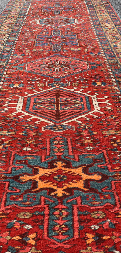 Antique Persian Heriz long Runner with Geometric medallions in Red, Teal, Orange, Blue, Yellow. Very Long antique Persian Heriz runner with geometric medallion design in red, blue and colorful tones, rug PTA - 21002 , country of origin / type: Ir... - Keivan Woven ArtsPTA - 21002 - 18006Rug