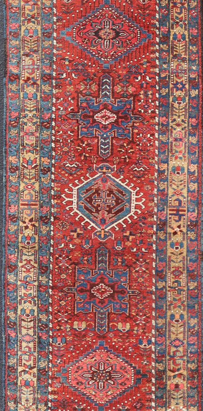 Antique Persian Heriz long Runner with Geometric medallions in Red, Teal, Orange, Blue, Yellow. Very Long antique Persian Heriz runner with geometric medallion design in red, blue and colorful tones, rug PTA - 21002 , country of origin / type: Ir... - Keivan Woven ArtsPTA - 21002 - 18006Rug