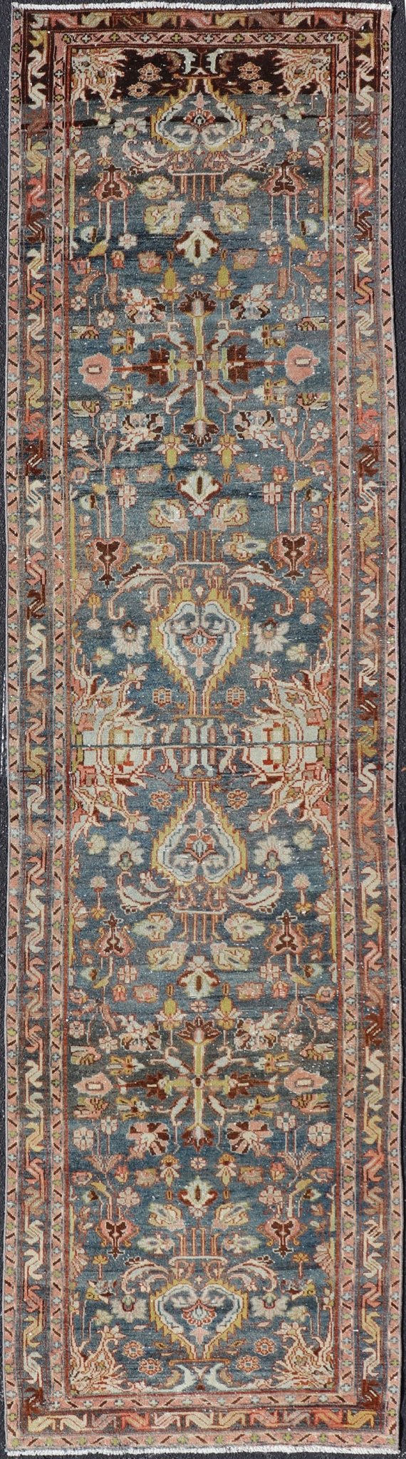 Antique Persian Malayer Runner All - Over Floral Design on A Blue Background This antique Persian Malayer runner is rendered in rich colors, from the blue background to the pink, coral, light yellow, brown, and light blue shown in the design... - Keivan Woven ArtsPTA - 21004 - 18084Rug