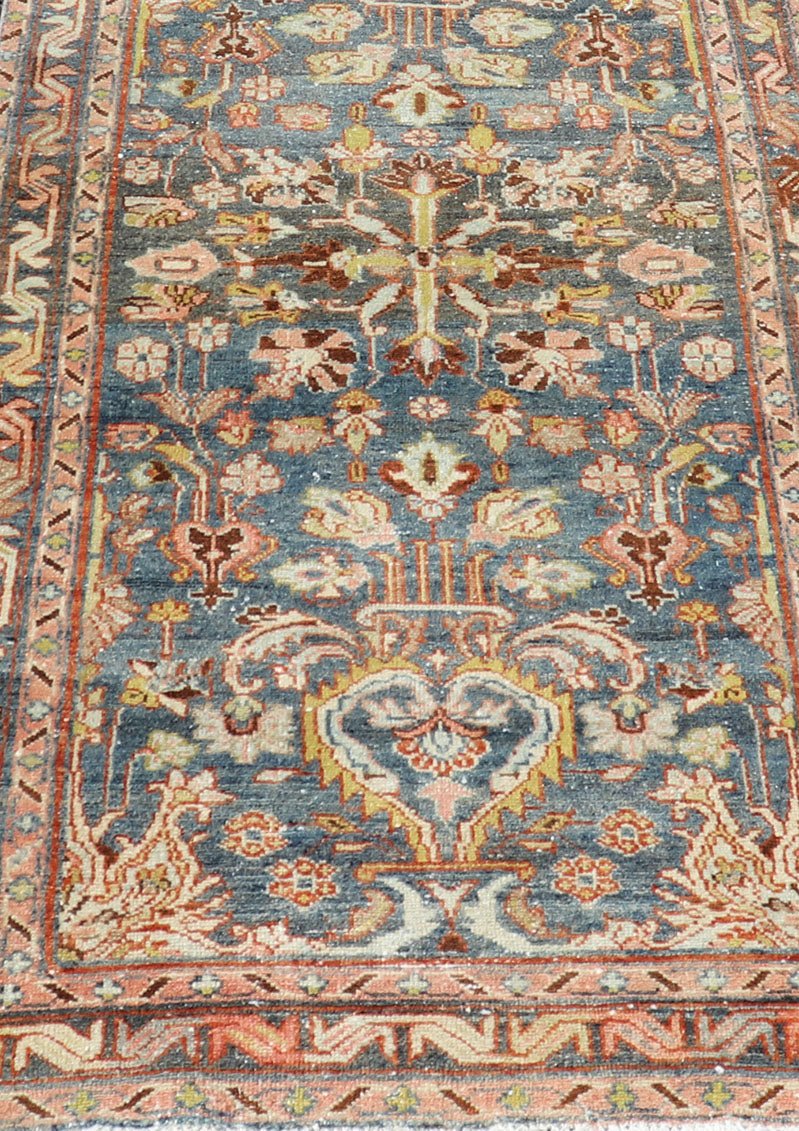 Antique Persian Malayer Runner All - Over Floral Design on A Blue Background This antique Persian Malayer runner is rendered in rich colors, from the blue background to the pink, coral, light yellow, brown, and light blue shown in the design... - Keivan Woven ArtsPTA - 21004 - 18084Rug