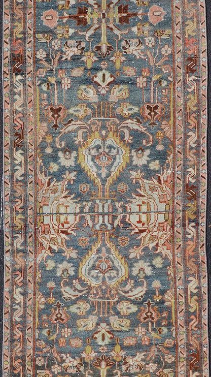 Antique Persian Malayer Runner All - Over Floral Design on A Blue Background This antique Persian Malayer runner is rendered in rich colors, from the blue background to the pink, coral, light yellow, brown, and light blue shown in the design... - Keivan Woven ArtsPTA - 21004 - 18084Rug
