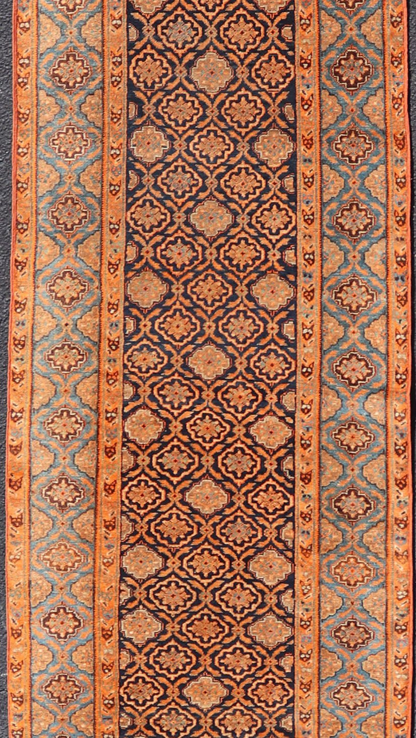 Large Antique Persian Khorasan rug with floral design in navy blue background, blue and orange rug PTA - 21007, country of origin / type: Iran / Khorasan, circa 1910 Keivan Woven Arts Antique Persian Khorasan Runner with All - Over Design in Blue... - Keivan Woven ArtsPTA - 21007 - 18024Rug