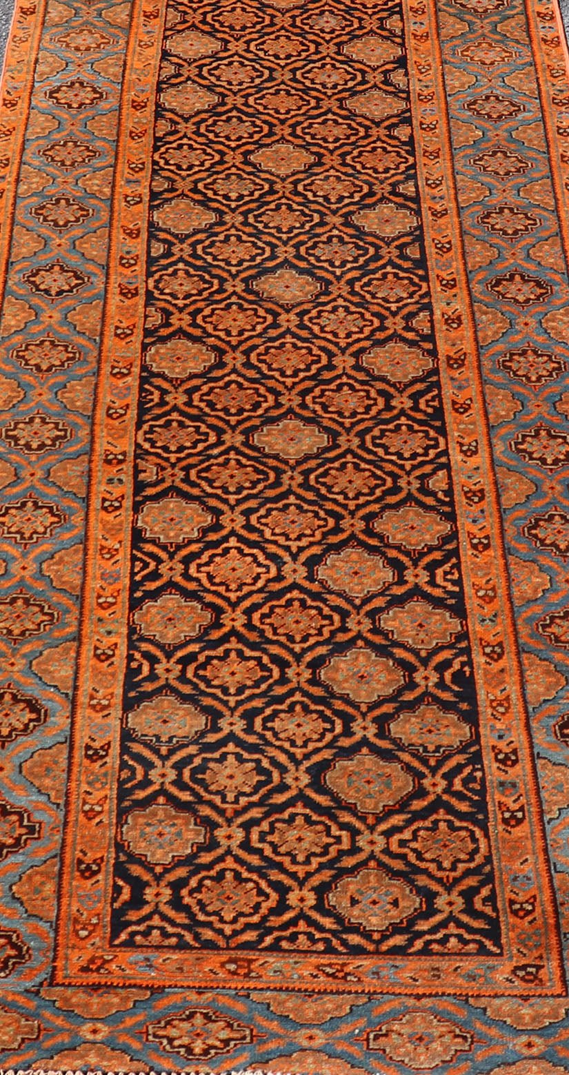 Large Antique Persian Khorasan rug with floral design in navy blue background, blue and orange rug PTA - 21007, country of origin / type: Iran / Khorasan, circa 1910 Keivan Woven Arts Antique Persian Khorasan Runner with All - Over Design in Blue... - Keivan Woven ArtsPTA - 21007 - 18024Rug