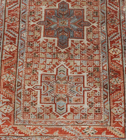 Vintage Persian Distressed Heriz Runner in Wool with Tribal Medallions This antique Persian Heriz rug features a distressed all - over sub - geometric design rendered in soft red as well as light blue tones, and is set upon an ivory background. A co... - Keivan Woven ArtsPTA - 21008 - 18090