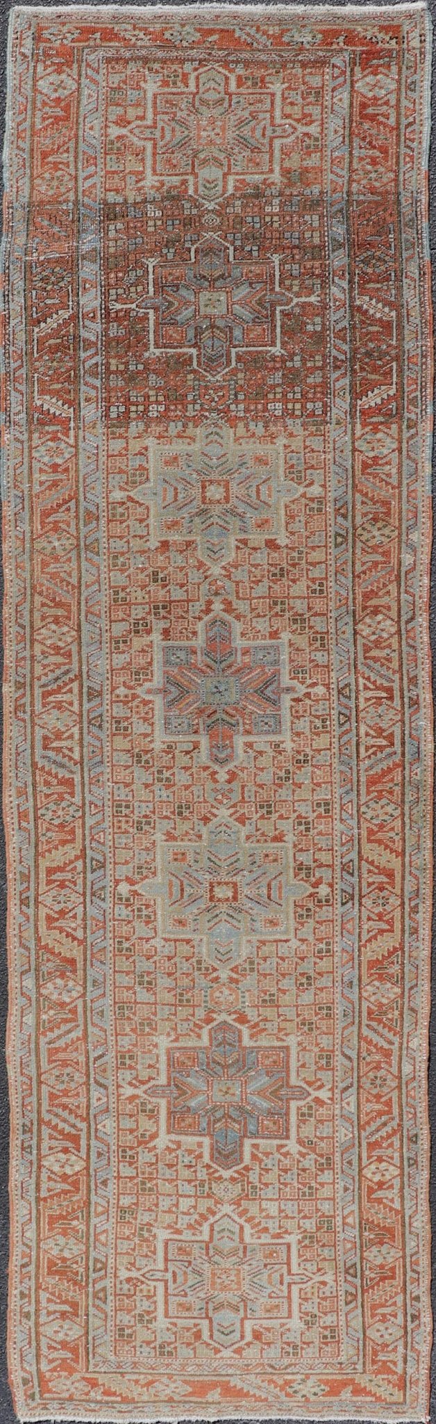 Vintage Persian Distressed Heriz Runner in Wool with Tribal Medallions This antique Persian Heriz rug features a distressed all - over sub - geometric design rendered in soft red as well as light blue tones, and is set upon an ivory background. A co... - Keivan Woven ArtsPTA - 21008 - 18090