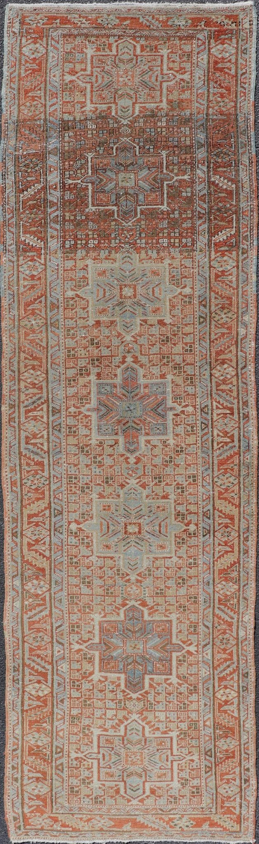Vintage Persian Distressed Heriz Runner in Wool with Tribal Medallions This antique Persian Heriz rug features a distressed all - over sub - geometric design rendered in soft red as well as light blue tones, and is set upon an ivory background. A co... - Keivan Woven ArtsPTA - 21008 - 18090