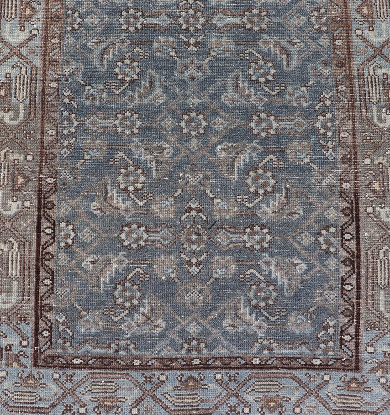 Antique Hand - Knotted Persian Hamadan Runner in Wool with All - Over Floral Design This antique Persian Hamadan rug has been hand - knotted in wool and features an all - over sub - geometric design rendered in multicolor. A complementary, multi - tiered b... - Keivan Woven ArtsPTA - 21011 - 18096