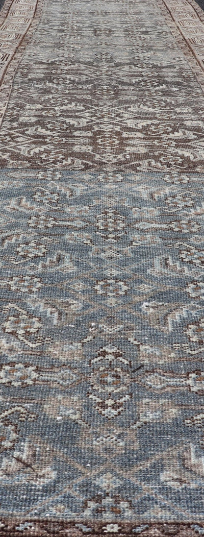 Antique Hand - Knotted Persian Hamadan Runner in Wool with All - Over Floral Design This antique Persian Hamadan rug has been hand - knotted in wool and features an all - over sub - geometric design rendered in multicolor. A complementary, multi - tiered b... - Keivan Woven ArtsPTA - 21011 - 18096